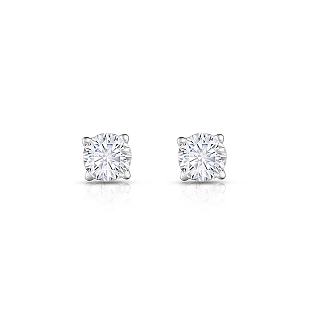 Pair of diamond stud earrings on a white background