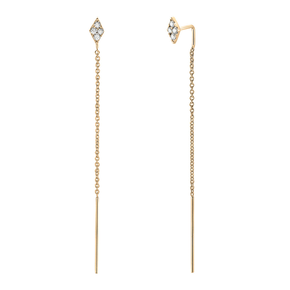 A pair of 14K yellow gold diamond threader earrings with a diamond-shaped stud and a long chain threading through the ear, ending in a gold bar.