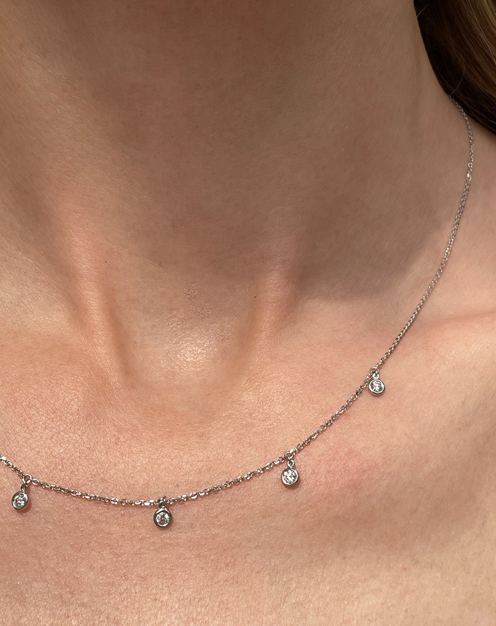 0.25 Carat White Gold and Diamond Station Necklace with Dangling Bezel Set Round Brilliant Cut Diamonds