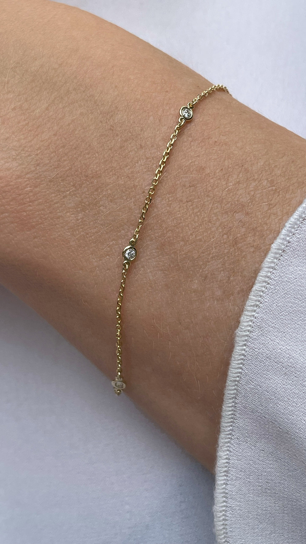 Yellow Gold and Diamond Station Bracelet with Bezel Set Round Brilliant Cut Diamonds