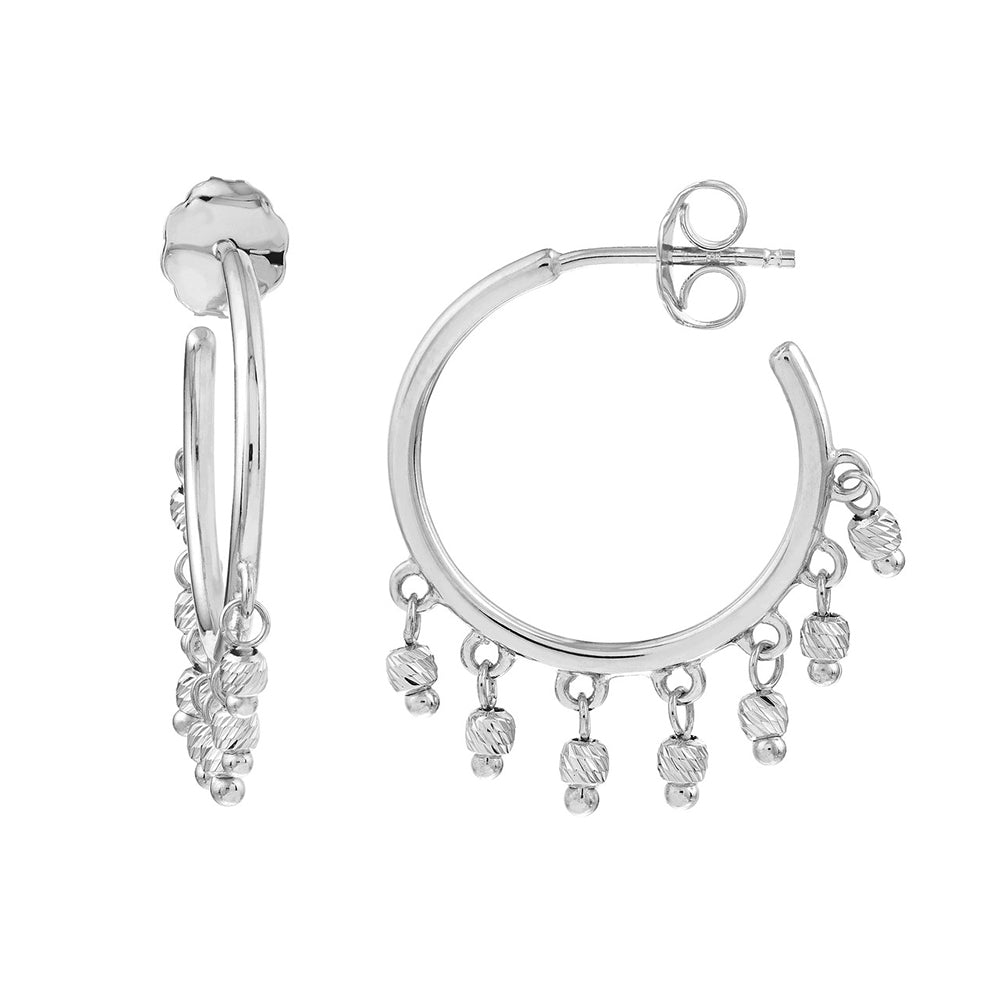 A pair of 14k white gold open hoop beaded earrings with dangling beads.
