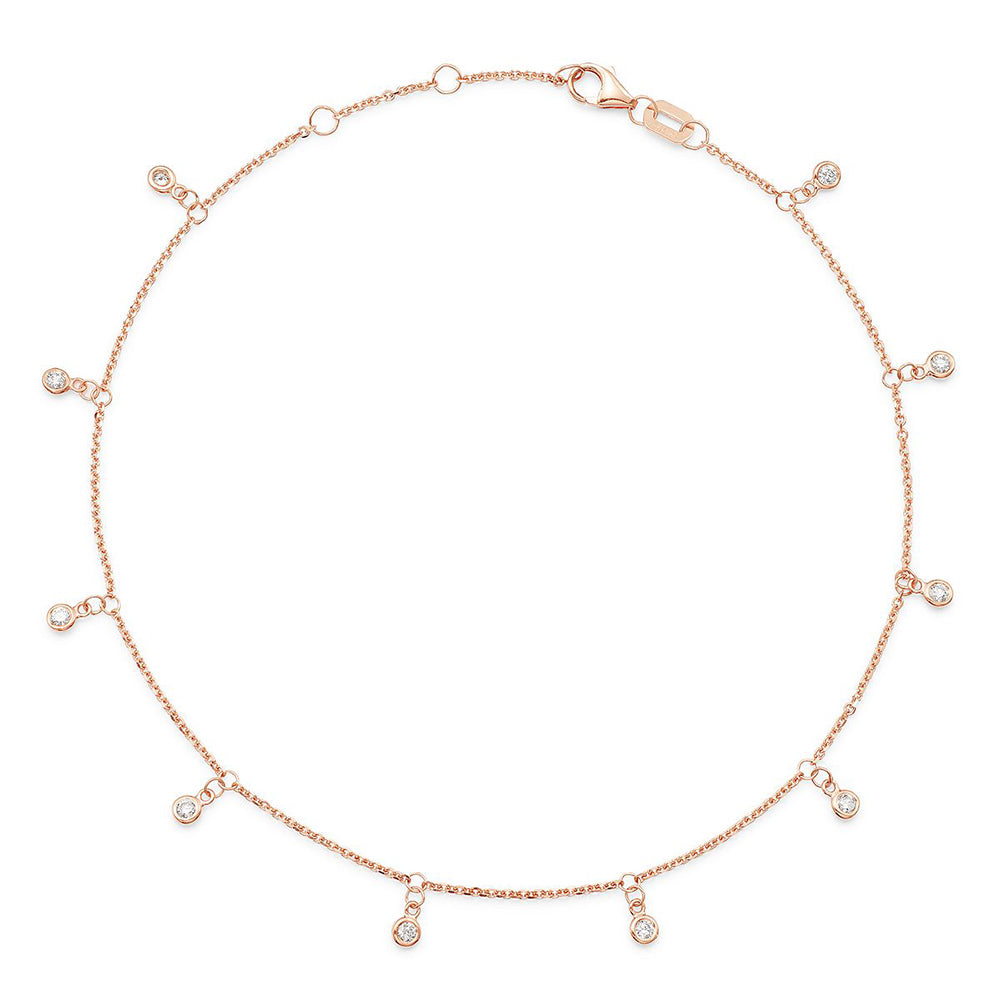 A rose gold chain anklet with dangling diamond stations