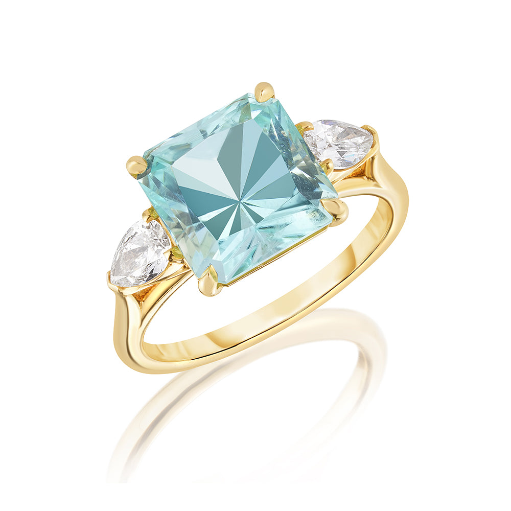 Three Stone Pale Blue, Princess Cut Tourmaline Ring with Pear Shape Diamond Side Stones set in 18K Yellow Gold October's Birthstone | Marisa Perry by Douglas Elliott