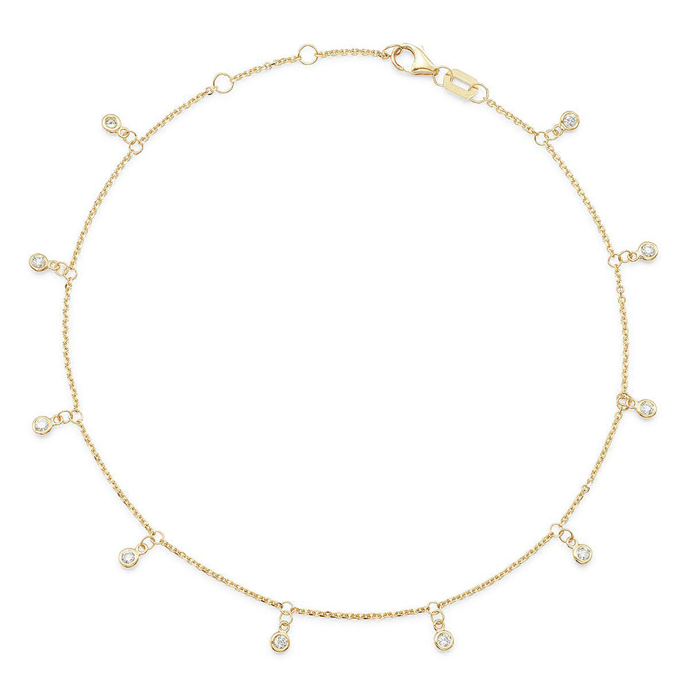 A yellow gold chain anklet with dangling diamond stations.