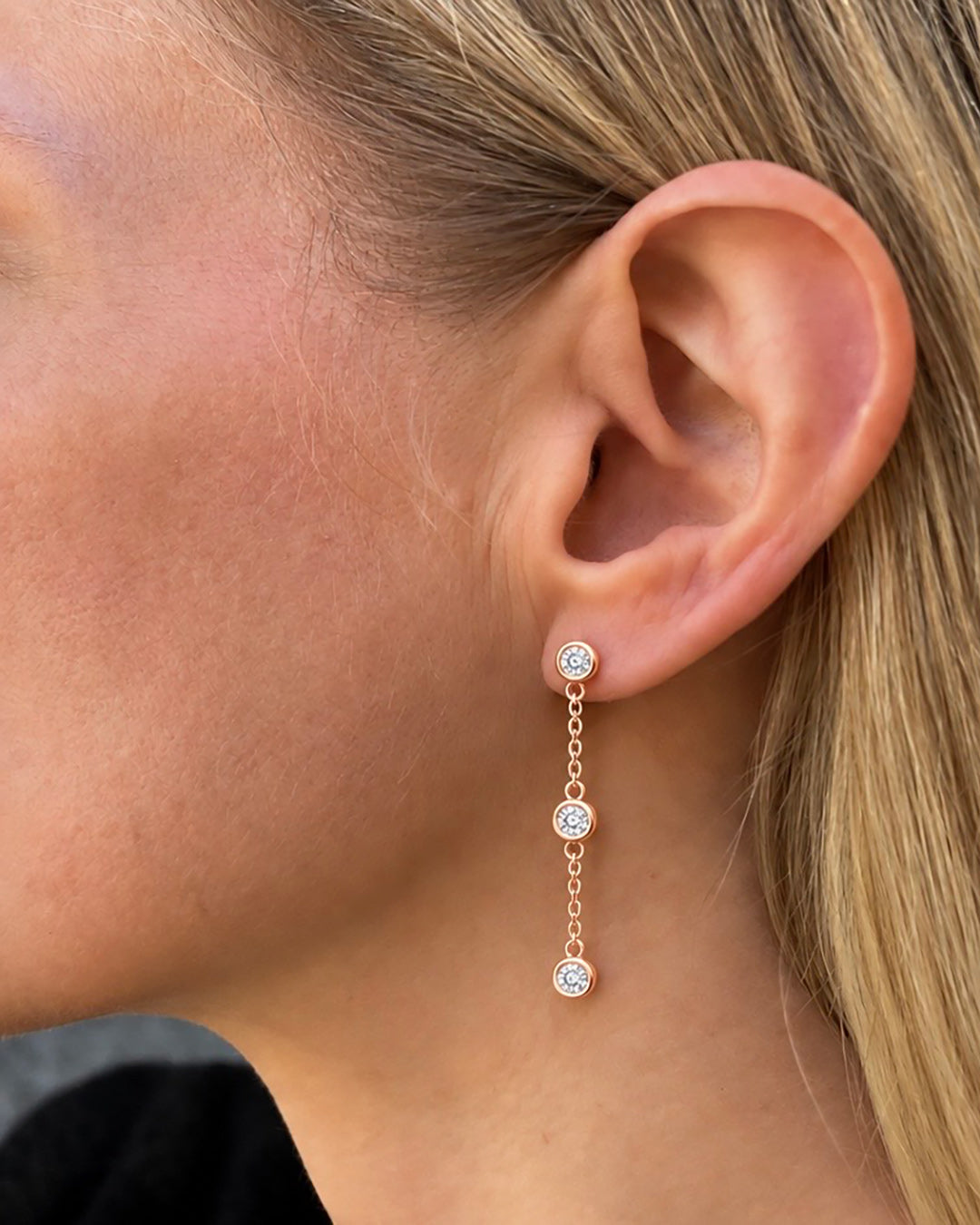 Bezel Set Diamond Drop Earrings in 14K rose gold featuring three round brilliant-cut diamonds suspended along each delicate cable chain.