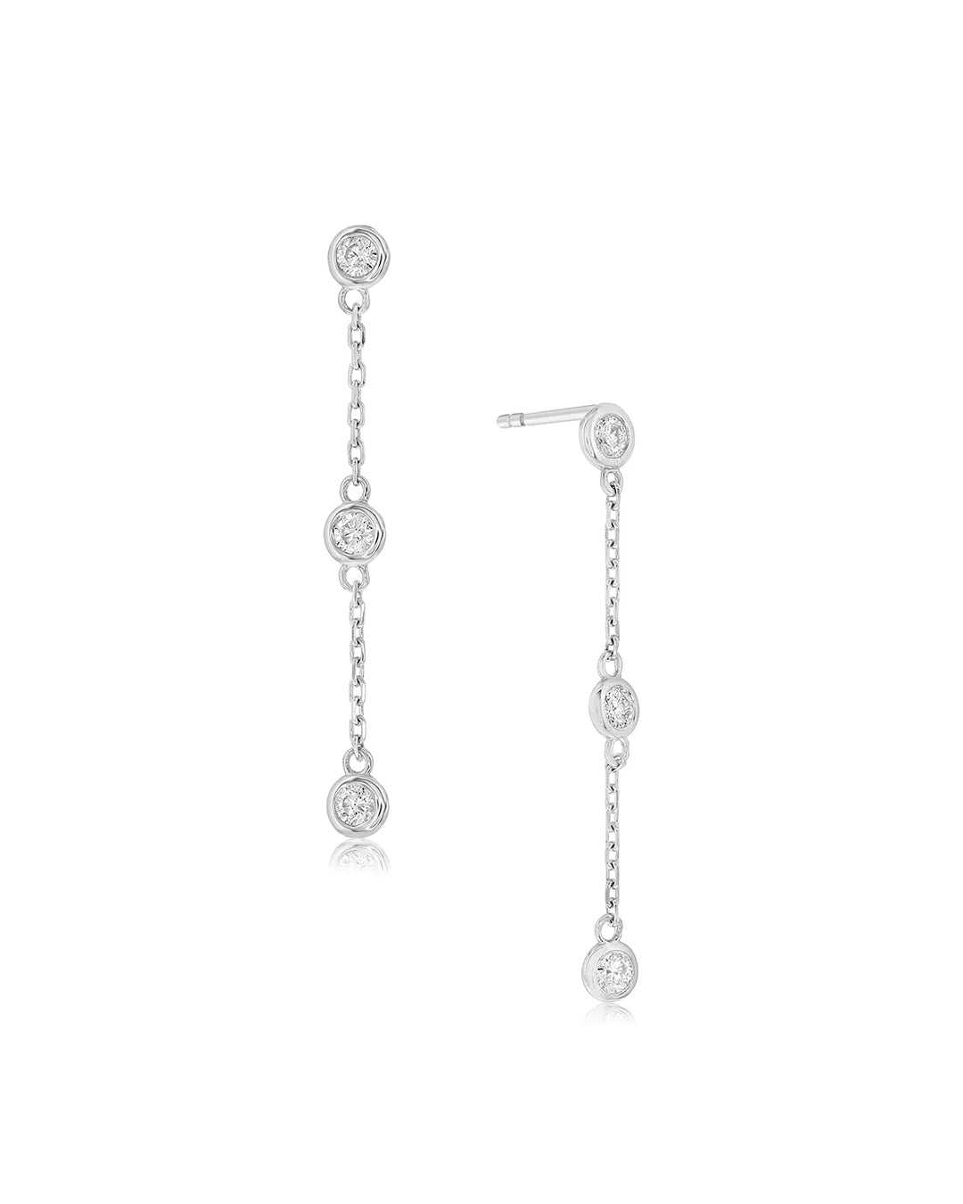 Bezel Set Diamond Drop Earrings in 14K white gold featuring three round brilliant-cut diamonds suspended along each delicate cable chain.