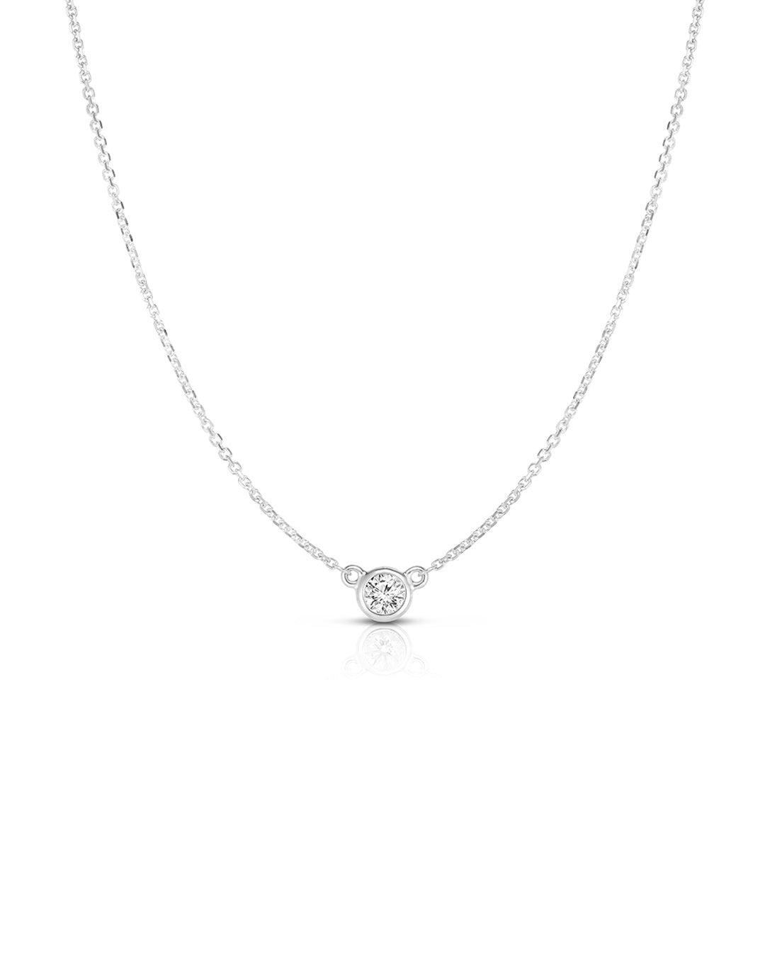 Bezel Set Diamond Solitaire Pendant Necklace in 14K white gold featuring a 0.15 carat round brilliant-cut diamond.