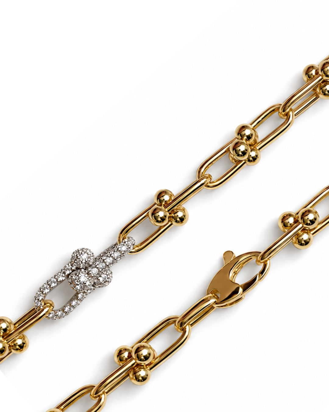 Close-up of Diamond and Gold Ball Link Bracelet in 14K yellow gold featuring elongated links, polished gold ball accents, and two diamond-set links totaling 0.50 TCW.