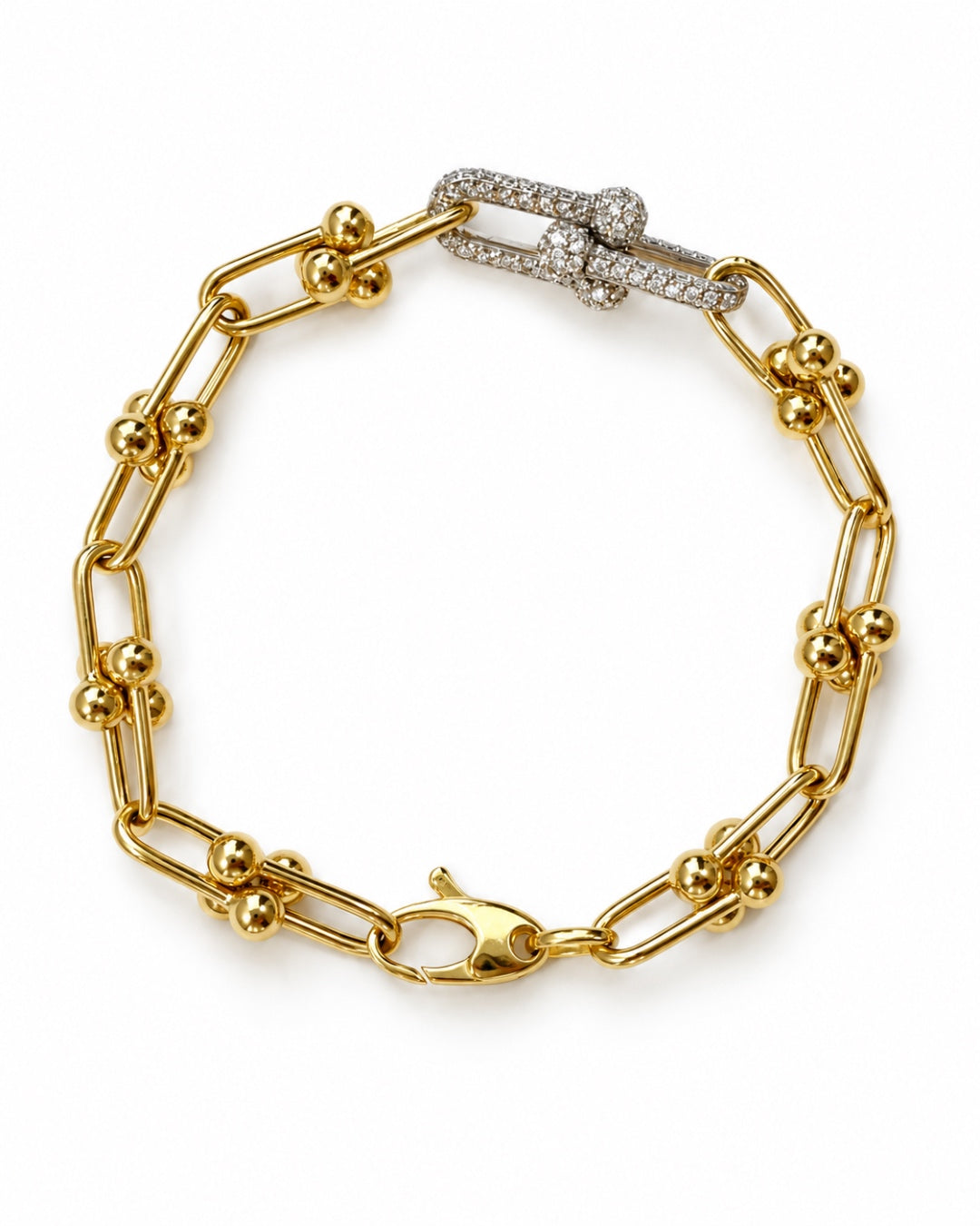 Diamond and Gold Ball Link Bracelet in 14K yellow gold featuring elongated links, polished gold ball accents, and two diamond-set links totaling 0.50 TCW.
