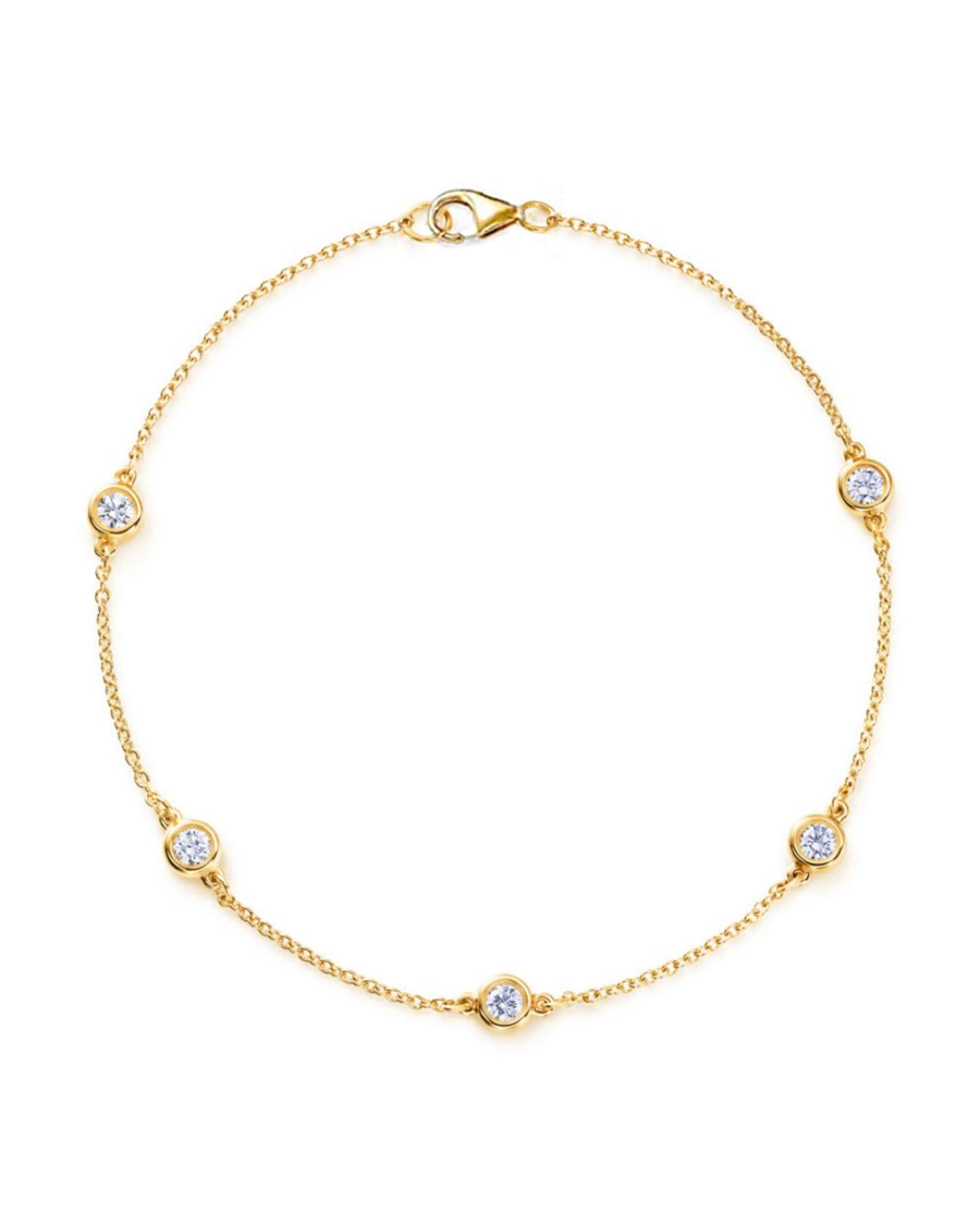 14K yellow gold diamond station bracelet featuring five bezel-set round brilliant-cut diamonds along a delicate chain.