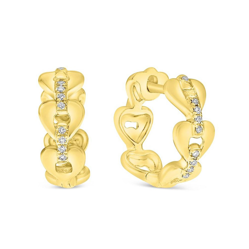 Gold heart-shaped earrings with diamond accents on a white background