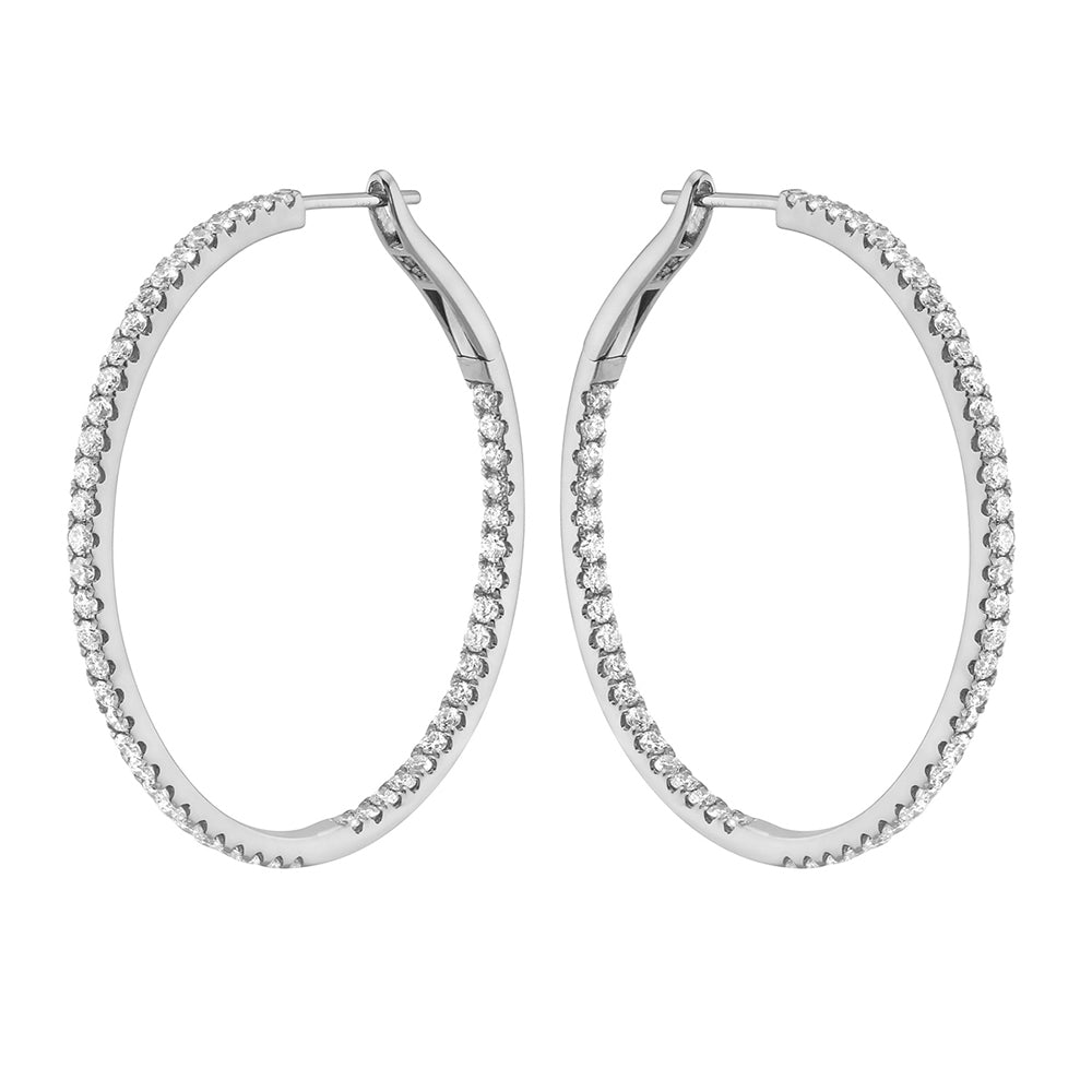 Pair of Express Yourself diamond hoop earrings in 14K white gold featuring 104 round brilliant diamonds totaling 1.76 carats.