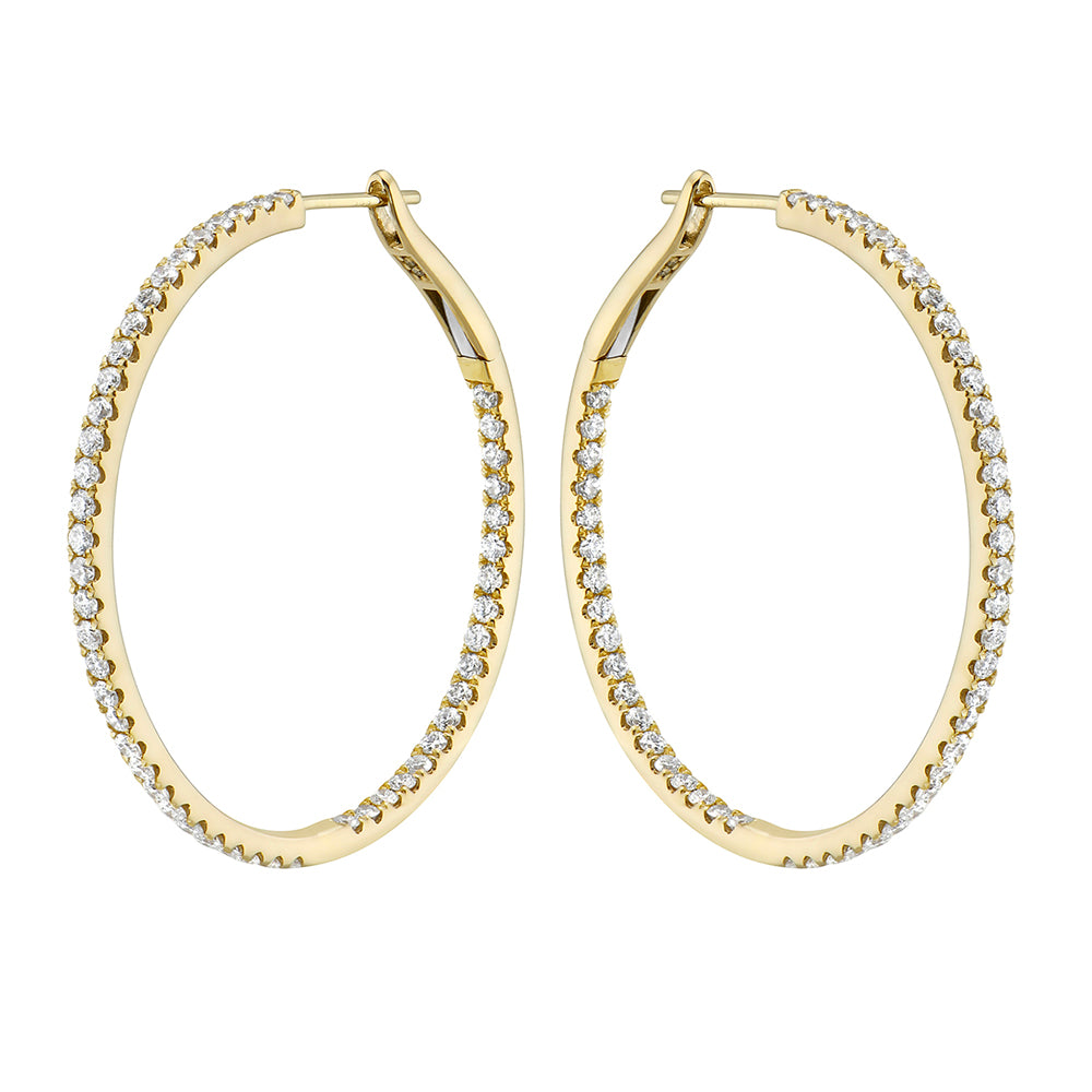 Pair of Express Yourself diamond hoop earrings crafted in 14K yellow gold with 104 round brilliant diamonds.