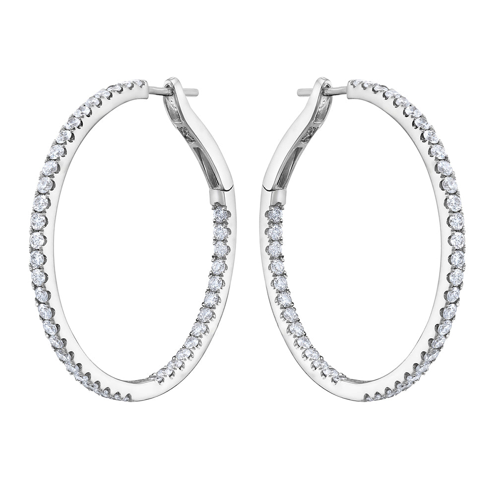 Pair of Harmony diamond hoop earrings crafted in 14K white gold with 84 round brilliant diamonds.