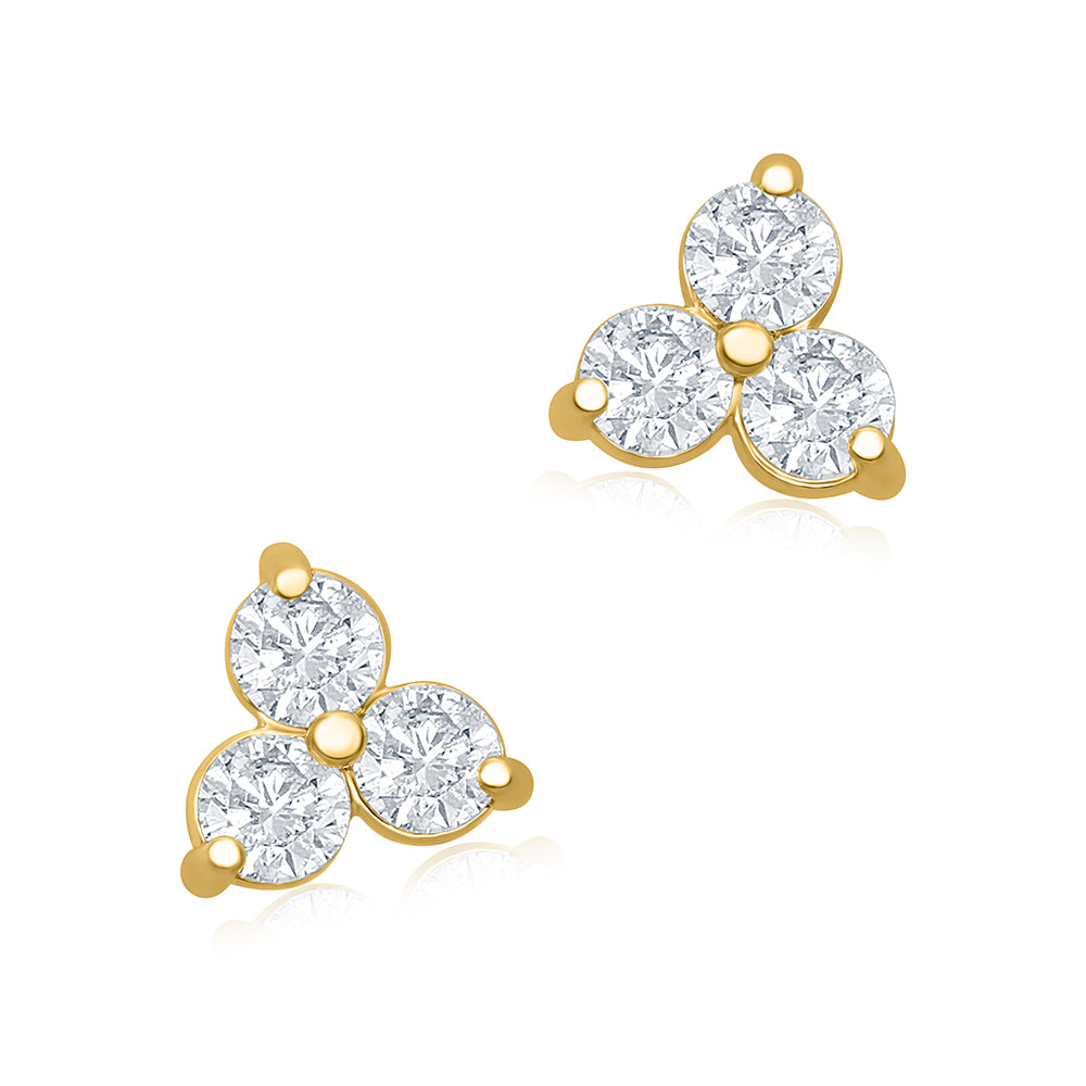 A pair of medium yellow gold trilogy stud earrings with three round brilliant cut diamonds totaling 0.60 carats.