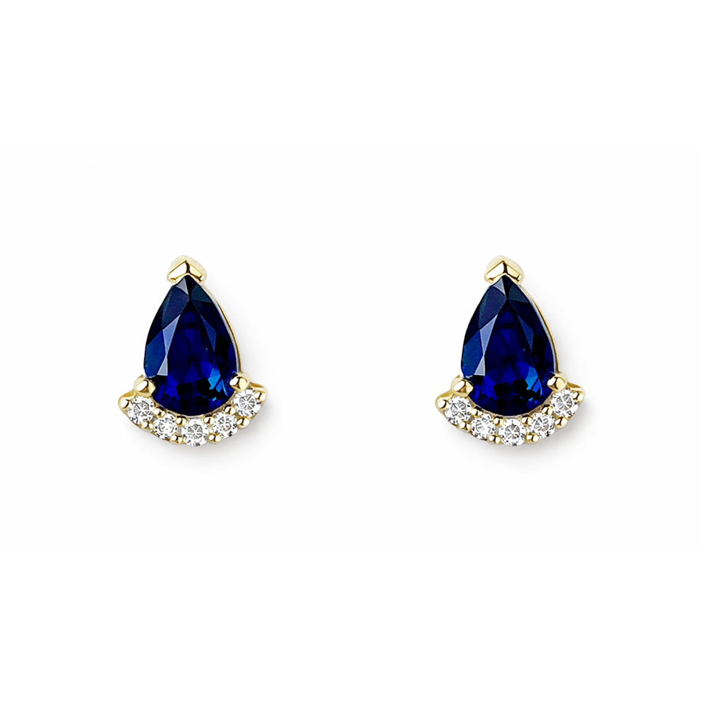 Pair of gold earrings with blue pear shaped sapphires on a white background
