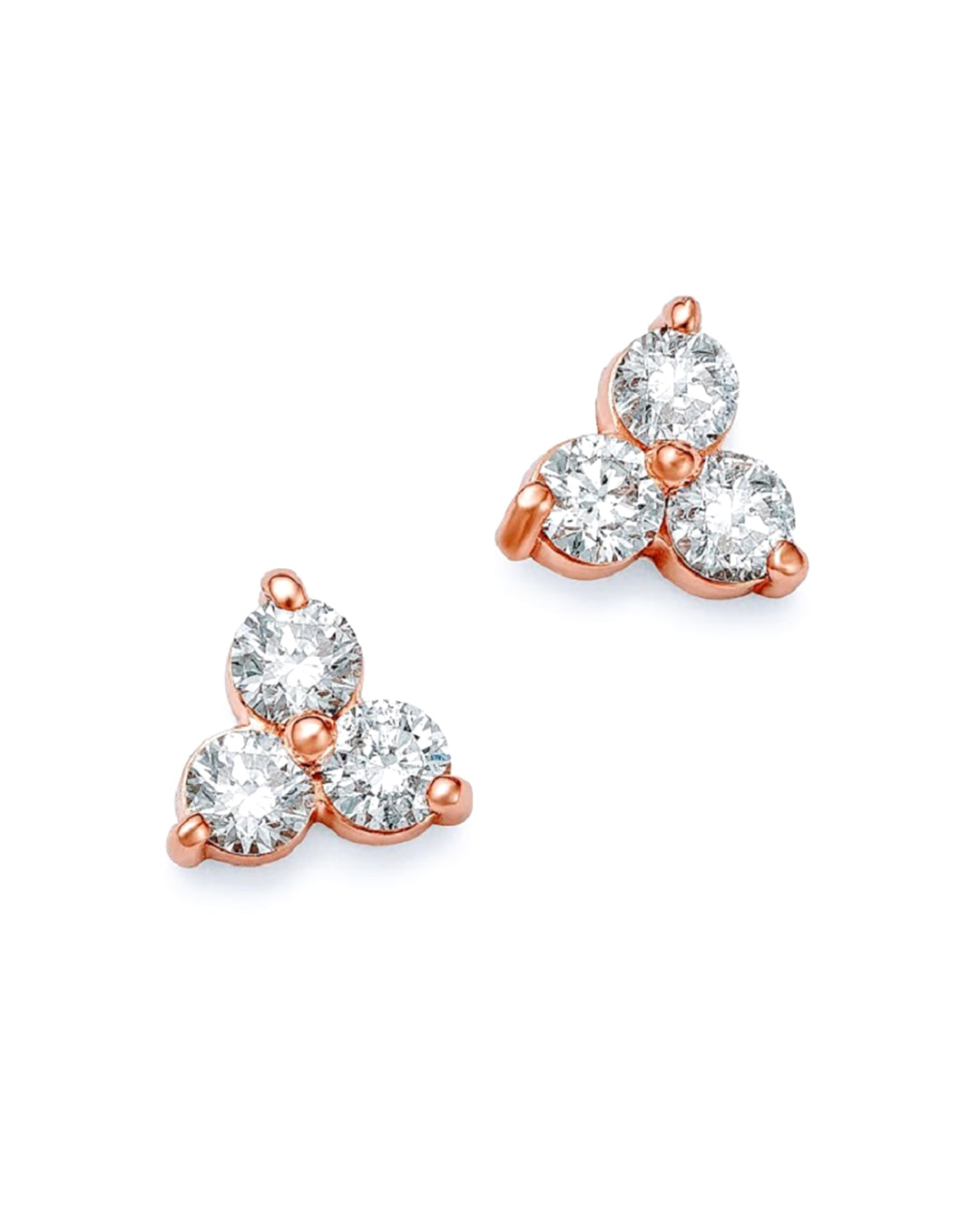 A pair of petite rose gold trilogy stud earrings featuring three round brilliant cut diamonds.