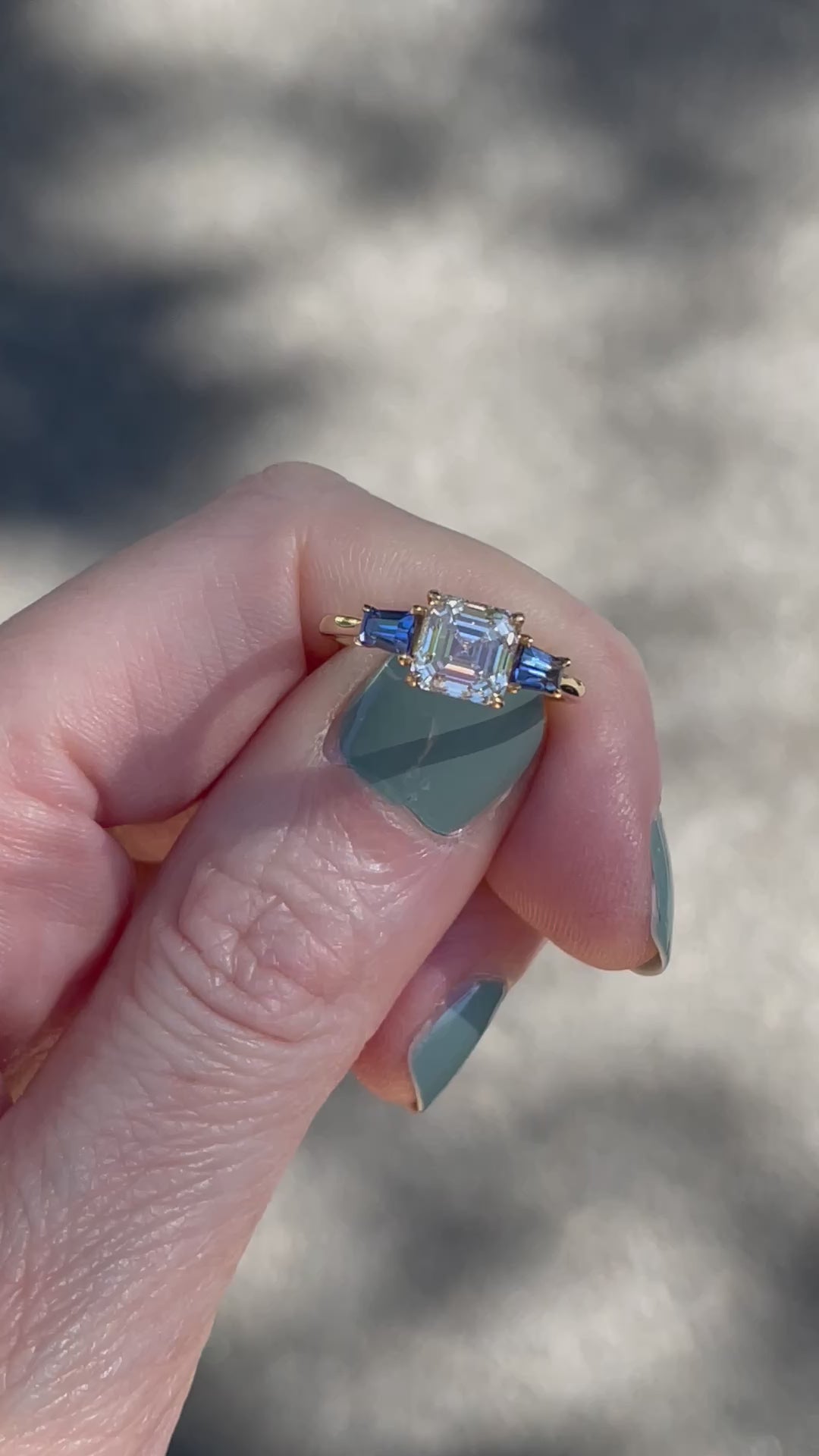 The Asscher Cut Three Stone Ring with Blue Sapphire Tapered Baguettes_G18623_Video2