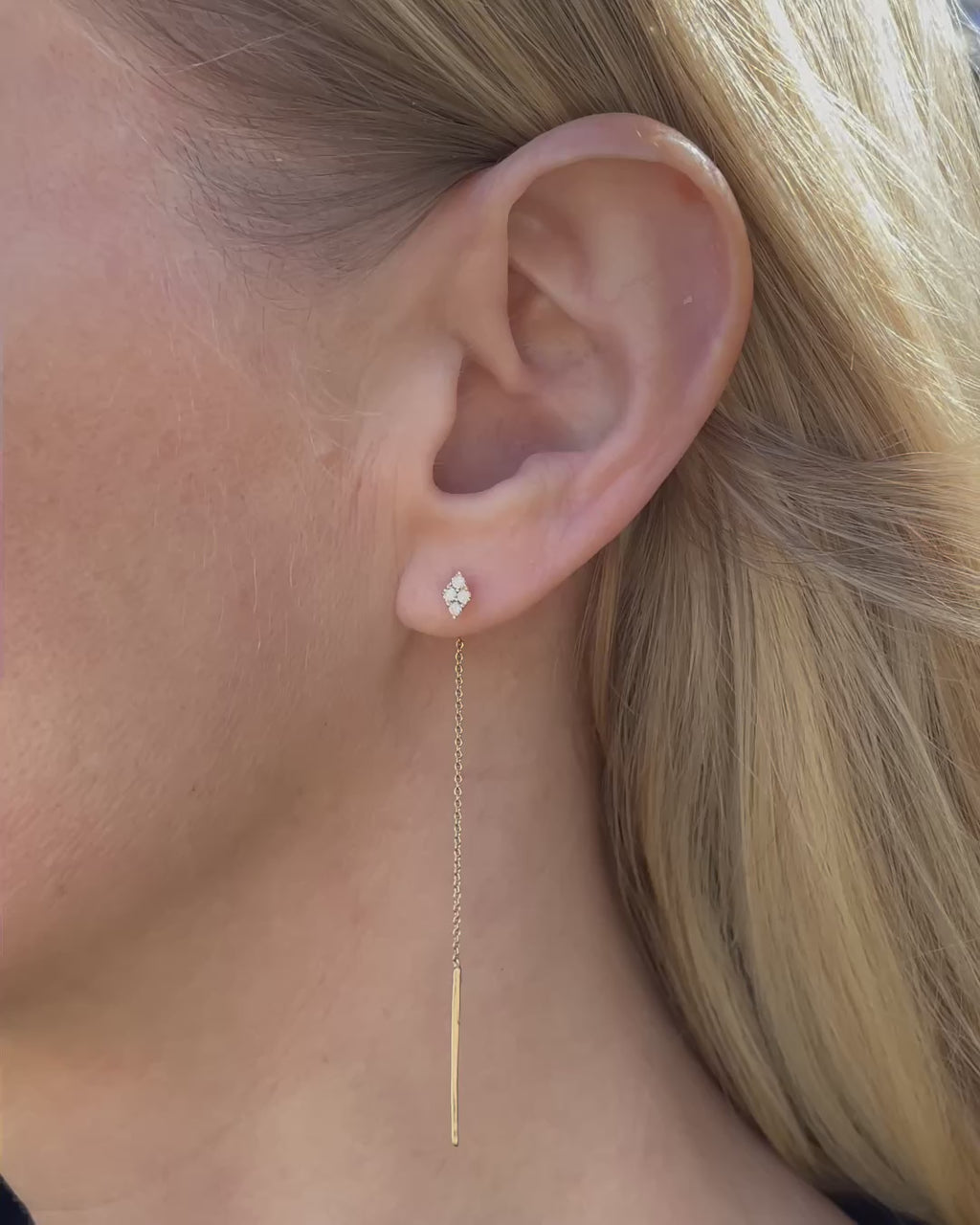 Diamond Cluster Threader Earrings in 14K yellow gold shown on a model's ear and displayed in a navy velvet Marisa Perry jewelry box, highlighting the diamond clusters, delicate chains, and polished threader bars.