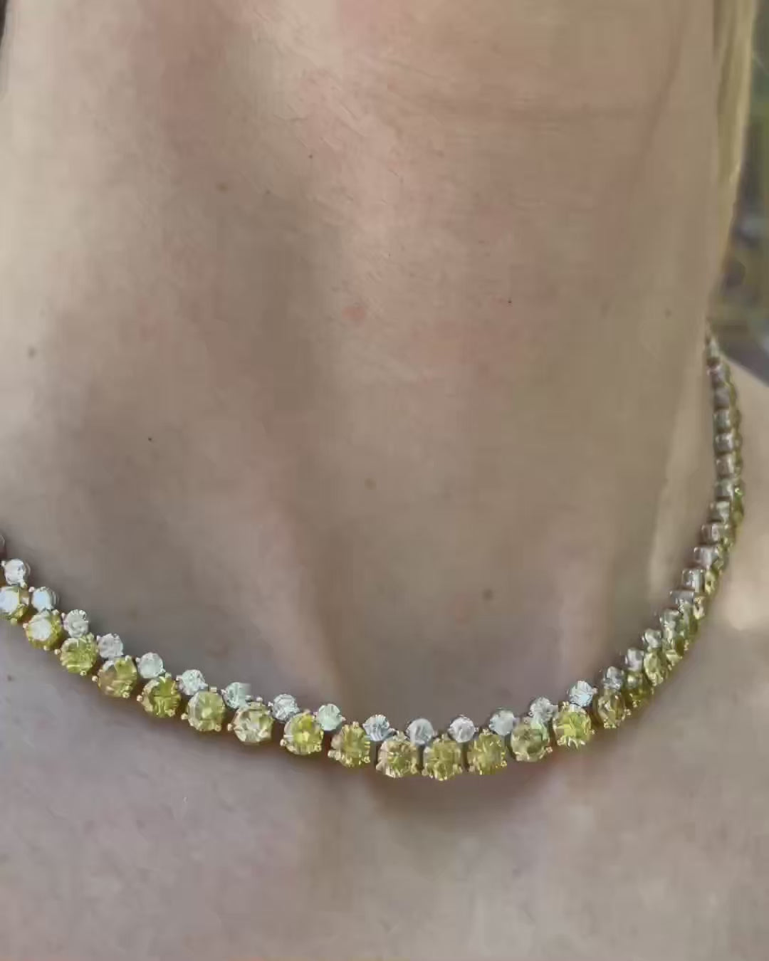 Alternating White and Yellow Diamond Tennis Necklace shown on a model, followed by close-up views highlighting the necklace's natural white and yellow diamonds and displayed in a navy velvet Marisa Perry jewelry box. 