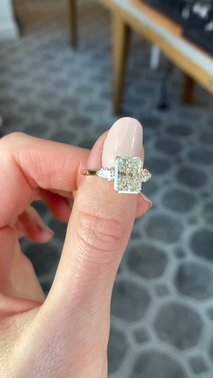 Three_Stone_Radiant_Cut_Diamond_Engagement_Ring_With_Pears_Marisa_Perry_by_Douglas_Elliott_G11238_Video