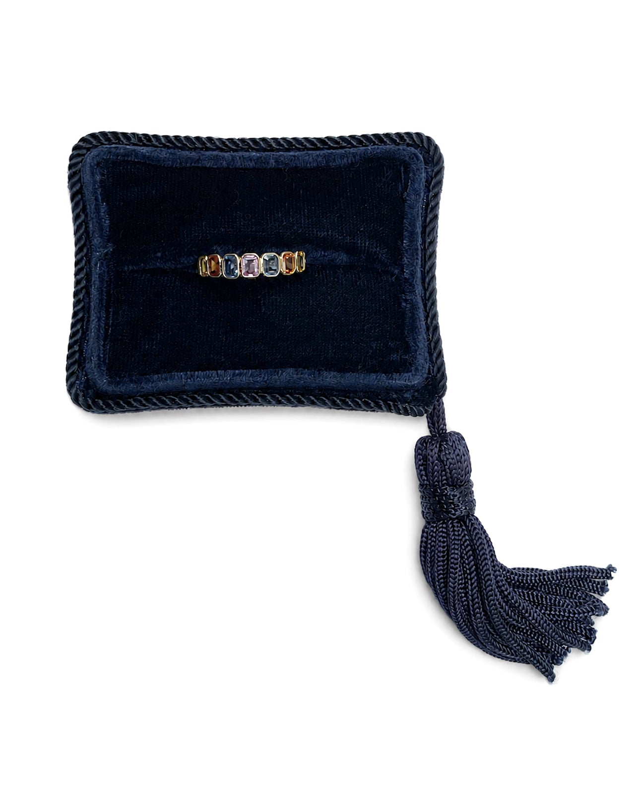 Rainbow Bezel Set Sapphire Ring displayed in a navy velvet Marisa Perry jewelry box.