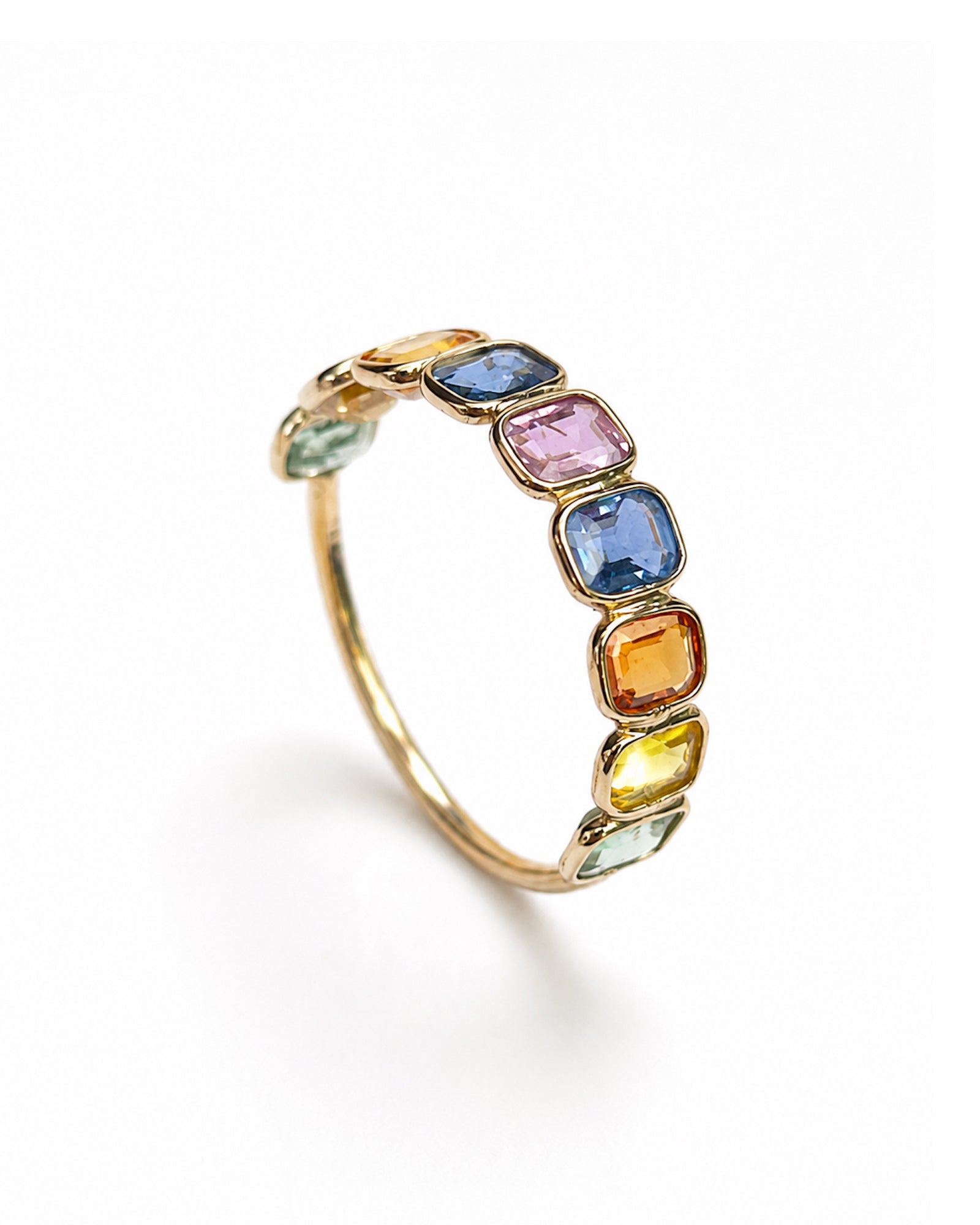 Rainbow Bezel Set Sapphire Ring in 14K yellow gold featuring 2.15 TCW of emerald-cut multicolor sapphires.