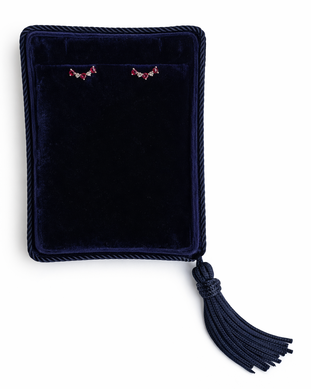 Ruby and Diamond cluster stud earrings in a navy blue Marisa Perry jewelry box.
